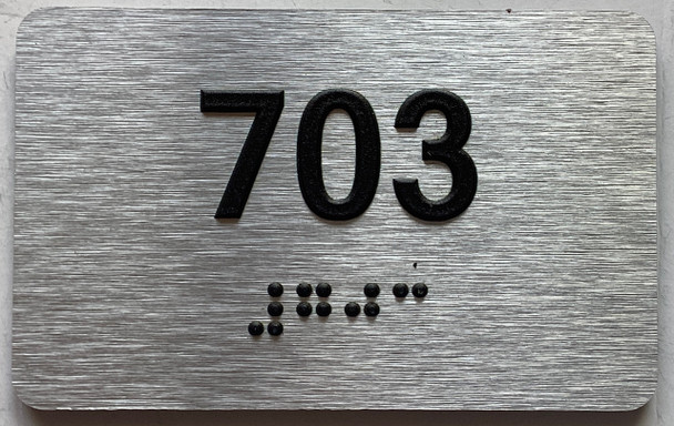 apartment number 703 sign