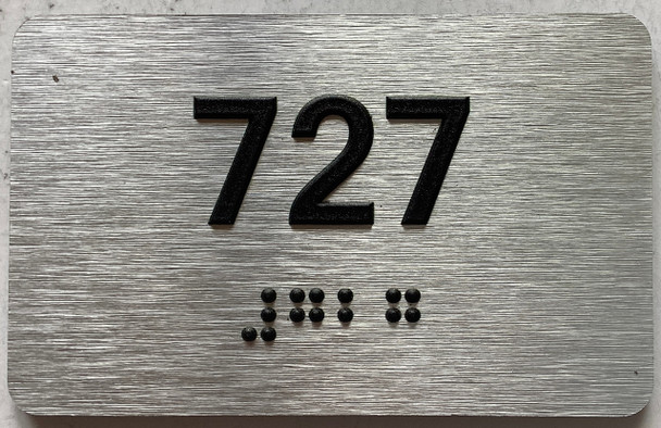 apartment number 727 sign