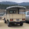 Rear of a beautiful tan VW Doka with Twin Peaks Bumper Installed