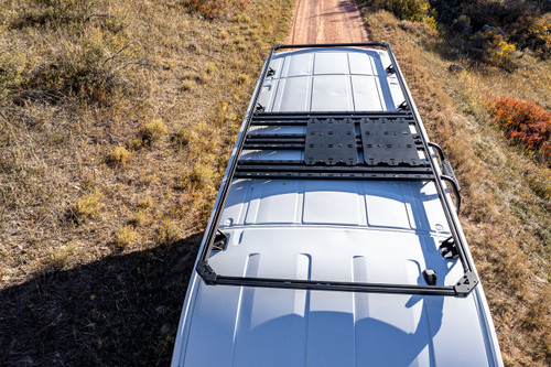 Rooftop Deck Approach Package on a white Ford Transit mid-mounted position