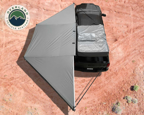 OVS Nomadic Awning 180 - For mid- and high-roof vehicles installed on vehicle in desert OVS Nomadic Awning 180 - For mid- and high-roof vehicles installed on vehicle in desert