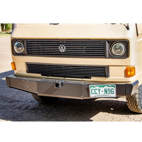 Detail of Twin Peaks front bumper optional receiver hitch installed on a yellow vw vanagon