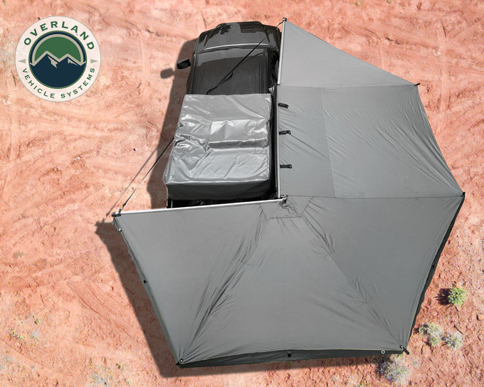 OVS 270 Passenger Side Awning For Mid - High Roof Vans installed on a vehicle in the desert