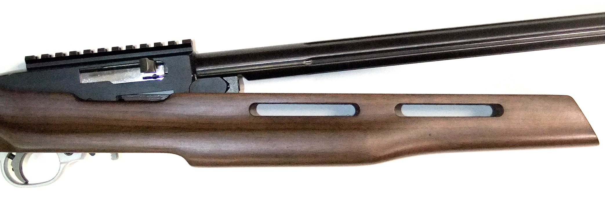 Barrel pivots upward and downward from the rear of receiver.