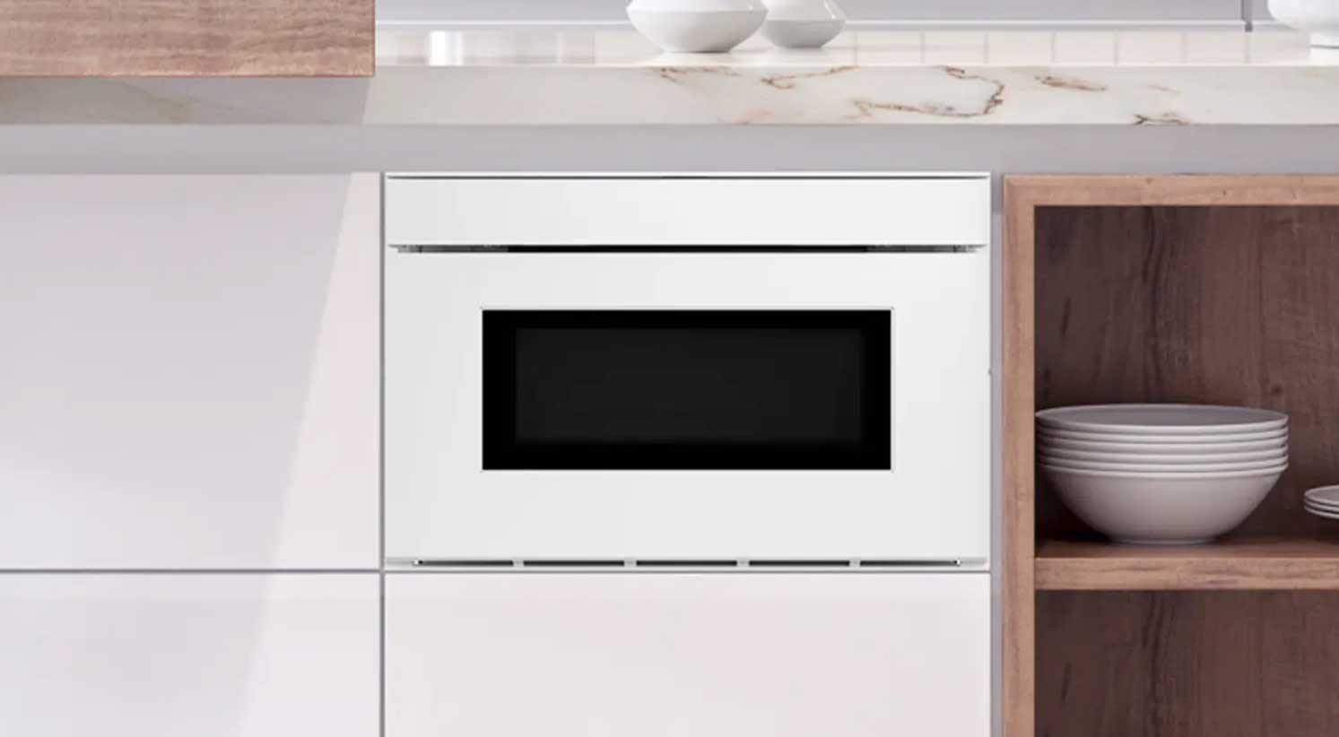 Sharp Deco Series Microwave Drawer Oven in matte white, built into a modern kitchen cabinet run