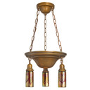  A traditional, Victorian or transitional Craftsman style chandelier with an aged finish and lights. It has cylindrical blown glass shades with a gold and red feather design.