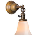  A Craftsman style wall sconce with a hook on the arm, an aged brass finish, turn key socket and a tapered white glass shade.