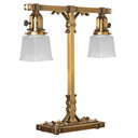  A stout and burly Arts & Crafts or Craftsman table lamp with an aged brass finish and rectangular, white shades.