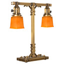  A stout and burly Arts & Crafts or Craftsman table lamp with an aged brass finish and rectangular, orange shades.