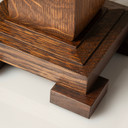  Detail view of craftsman lamp base showing traditional stepped wooden construction and rich quarter-sawn oak grain patterns with precision joinery techniques.