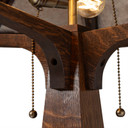  Internal mechanism detail showing Edison-style bulbs, brass pull-chain switches, and quarter-sawn oak support structure within the handcrafted octagonal shade design.