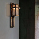  Prairie School wall sconce with quarter-sawn oak frame and frosted mica panels mounted on modern interior wall.