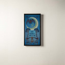  An art canvas print of a bat and crescent moon in a black float frame.