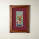  An archival art print of a monarch butterfly on pink flowers. It has a maroon mat and foursquare oak frame.