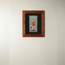  An archival art print of a monarch butterfly on pink flowers. It has a black mat and 2