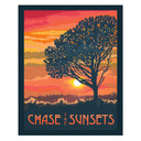  A bold silhouette of a tree stands against a vibrant orange and pink sunset over rolling hills. The design features the phrase “Chase the Sunsets” in warm, glowing tones. It has a canvas texture.