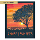  A bold silhouette of a tree stands against a vibrant orange and pink sunset over rolling hills. The design features the phrase “Chase the Sunsets” in warm, glowing tones. It is labeled 