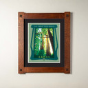 An archival print of a forest scene. It's in a double mat with a foursquare oak frame.
