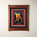 An archival print of a roaring bonfire. It has a double mat in a mortise and tenon oak frame.