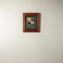  An archival print of a gold and green landscape scene. It has a double mat in a 2
