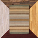  A modern styled striped rug with a brown and green color scheme against floor color samples.