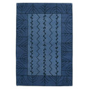  An Americana-inspired handcrafted wool rug with a floral or grain design in a deep blue palette. 