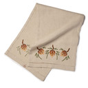  Full length rectangular linen decorative table scarf featuring an embroidered pine cone motif in a gradient of warm colors with olive green pine accents.