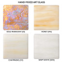  Four samples of Old California's hand mixed art glass on a white background including gold iridescent, honey, champagne and wispy white.
