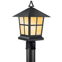  A classic, traditional sloped-roof post mounted light fixture with crown molding accent, a black finish and warm colored glass.