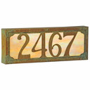  An illuminated house number plaque with a four number address, an aged patina finish and glowing glass.