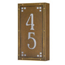  A solid brass, vertically oriented illuminated house number plaque with a two number address, an aged finish, white glass and corner glass accents.