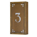  A solid brass, vertically oriented illuminated house number plaque with a single number address, an aged finish, white glass and corner glass accents.