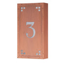  A solid brass, vertically oriented illuminated house number plaque with a single number address, a raw copper finish, white glass and corner glass accents.