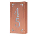  A solid brass, vertically oriented illuminated house number plaque with a two number address, a raw copper finish, white glass and corner glass accents.