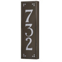  A solid brass, vertically oriented illuminated house number plaque with a three number address, a bronze finish, white glass and corner glass accents.