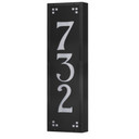  A solid brass, vertically oriented illuminated house number plaque with a three number address, a satin black finish, white glass and corner glass accents.