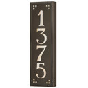  A solid brass, vertically oriented illuminated house number plaque with a four number address, a bronze finish, warm glass and corner glass accents.