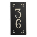  A solid brass, vertically oriented illuminated house number plaque with a two number address, a satin black finish, warm-toned glass and corner glass accents.