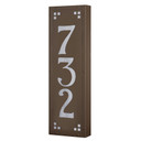  A solid brass, vertically oriented illuminated house number plaque with a three number address, a smooth bronze finish, white glass and corner glass accents.