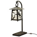  A beefy, rustic table lamp on a hooked arm with Gothic literature raven silhouettes in trees, a satin black finish and white glass.