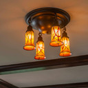  A ceiling light fixture with cherry blossom shades installed in a historic home for one of Brett Waterman's home transformations.