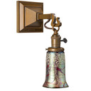  A reproduction Craftsman style 1910s wall mounted sconce lantern with an aged brass finish, a turn key socket and a trumpet shaped cherry blossom blown glass shade.