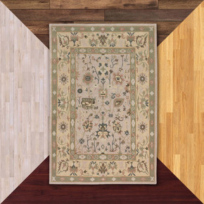  This rug features a traditional Persian Garden design, characterized by a series of individual pictorial panels and stylized motifs set against a soft ivory or cream field. It is against a background of floor color samples.