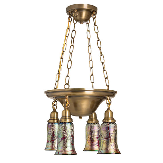  A traditional, Victorian or transitional Craftsman style chandelier with a glossy, aged finish and four lanterns. The lanterns have trumpet shaped blown glass shades with a cherry blossom design.