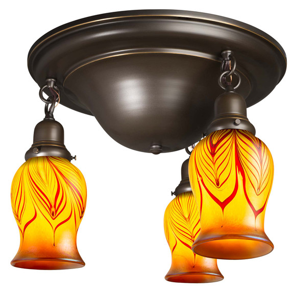  A traditional, Victorian or transitional Craftsman style ceiling light fixture with an oil rubbed bronze finish and three hanging lights. The lights have illuminated blown glass shades in a tulip shape with a red feather design.