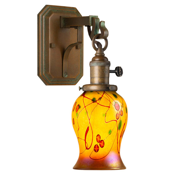  A reproduction of an antique Craftsman wall sconce light fixture with a metal corbel and hook mount for the lantern, which has a turn key socket, aged patina finish and an illuminated, tulip shaped poppy blown glass shade.