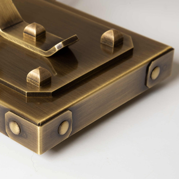  Base detail from a stout and burly Arts & Crafts or Craftsman table lamp with an aged brass finish.