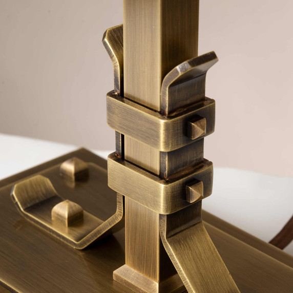  Joinery strap and rivet detail from a stout and burly Arts & Crafts or Craftsman table lamp with an aged brass finish.