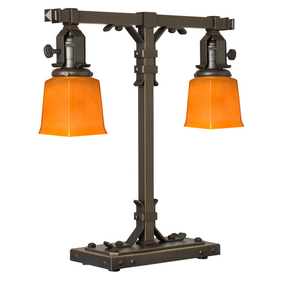  A stout and burly Arts & Crafts or Craftsman table lamp with an oil rubbed bronze finish and rectangular, orange glass shades.