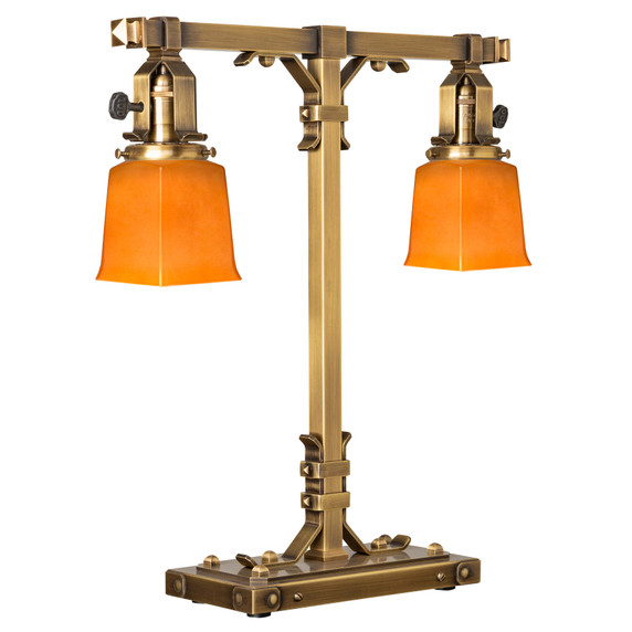  A stout and burly Arts & Crafts or Craftsman table lamp with an aged brass finish and rectangular, orange shades.